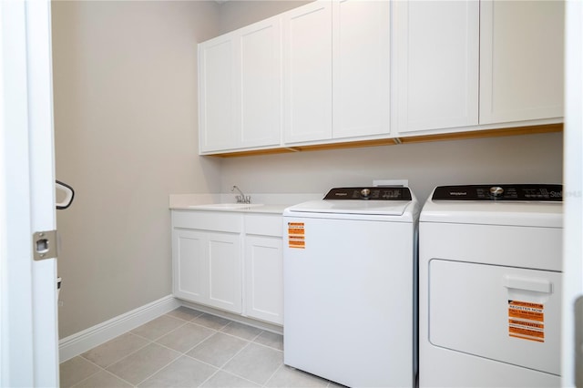 16489 Silver Brook Way, Winter Garden, FL 34787 - laundry area with cabinet space, washing machine and clothes dryer, baseboards, and light tile patterned floors