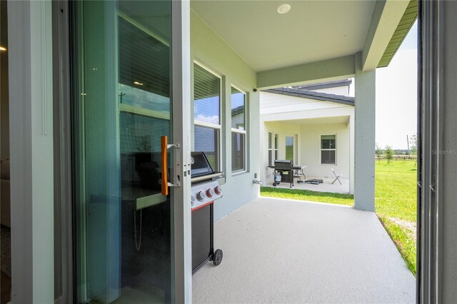 16489 Silver Brook Way, Winter Garden, FL 34787 - view of patio with a grill
