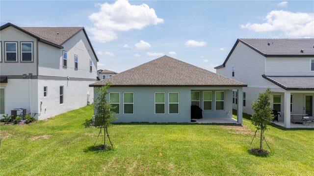 16489 Silver Brook Way, Winter Garden, FL 34787 - rear view of house featuring a patio, a shingled roof, and stucco siding