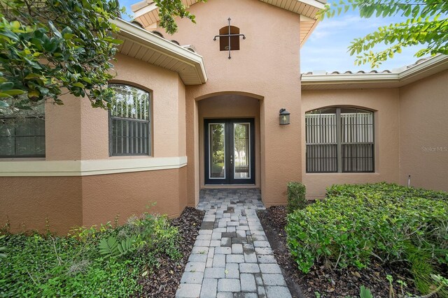 453 Sorrento Rd, Kissimmee, FL 34759 - property entrance with stucco siding and french doors