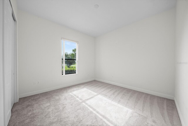 453 Sorrento Rd, Kissimmee, FL 34759 - spare room with carpet floors and baseboards