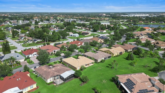 453 Sorrento Rd, Kissimmee, FL 34759 - aerial perspective of suburban area featuring a large body of water
