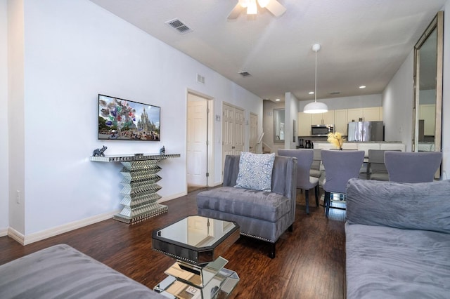3229 Cupid Pl, Kissimmee, FL 34747 - living room with wood finished floors, baseboards, and ceiling fan