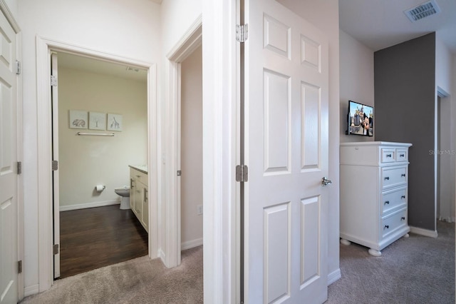 3229 Cupid Pl, Kissimmee, FL 34747 - hall with dark carpet and baseboards
