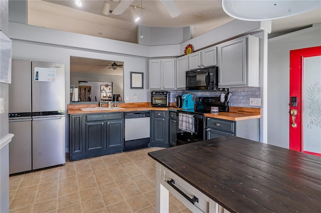 46 Frenora Ln, Palm Coast, FL 32137 - kitchen with black appliances, ceiling fan, wood counters, a sink, and a textured ceiling