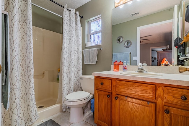 46 Frenora Ln, Palm Coast, FL 32137 - full bath featuring toilet, vanity, tile patterned floors, curtained shower, and a textured ceiling