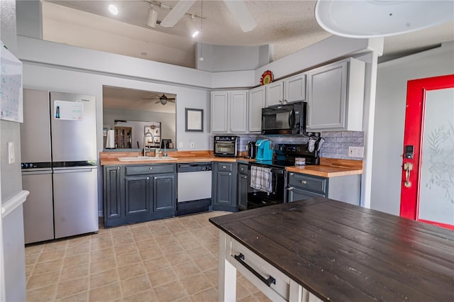 46 Frenora Ln, Palm Coast, FL 32137 - kitchen featuring black appliances, a sink, wood counters, a ceiling fan, and tasteful backsplash