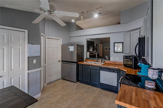 46 Frenora Ln, Palm Coast, FL 32137 - kitchen featuring wood counters, black appliances, a sink, a ceiling fan, and a textured ceiling