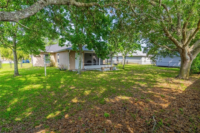 46 Frenora Ln, Palm Coast, FL 32137 - view of yard with a sunroom