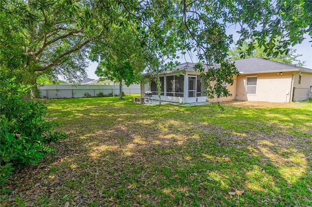 46 Frenora Ln, Palm Coast, FL 32137 - rear view of house featuring a sunroom and stucco siding