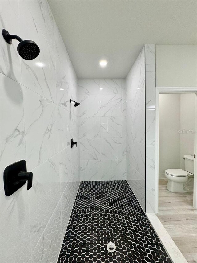 9335 N Fairy Lilly Dr, Citrus Springs, FL 34433 - full bathroom featuring toilet, a marble finish shower, wood finished floors, and recessed lighting