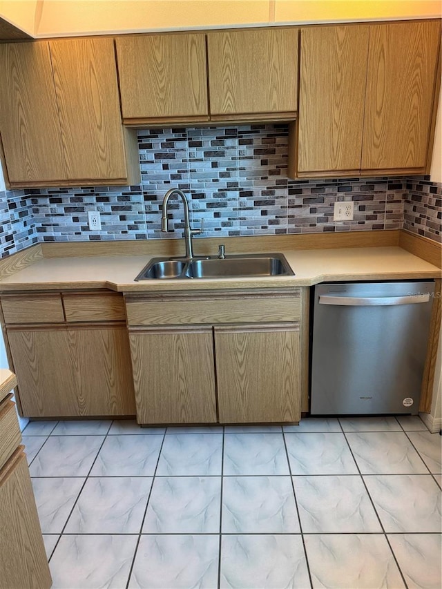 3360 Ocean Shore Blvd Unit 4050, Ormond Beach, FL 32176 - kitchen with stainless steel dishwasher, a sink, light marble finish flooring, and light countertops