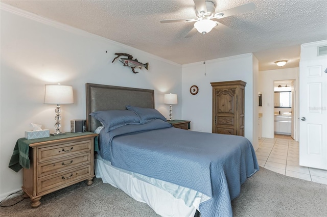 3360 Ocean Shore Blvd Unit 4050, Ormond Beach, FL 32176 - bedroom featuring a textured ceiling, ornamental molding, ensuite bathroom, light tile patterned floors, and a ceiling fan