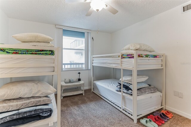 3360 Ocean Shore Blvd Unit 4050, Ormond Beach, FL 32176 - bedroom featuring carpet, a textured ceiling, a ceiling fan, and baseboards