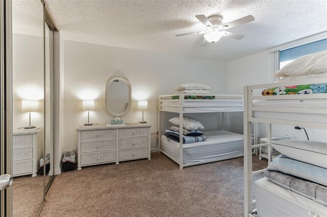 3360 Ocean Shore Blvd Unit 4050, Ormond Beach, FL 32176 - carpeted bedroom featuring a textured ceiling and a ceiling fan