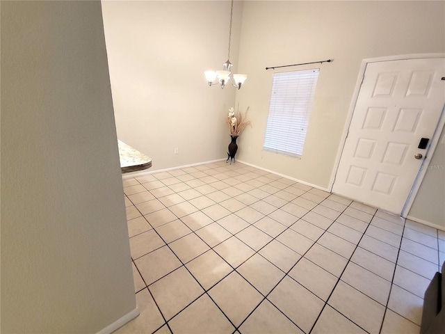1108 Northlake Dr Unit 1108, Sanford, FL 32773 - foyer entrance with a chandelier, light tile patterned floors, and baseboards