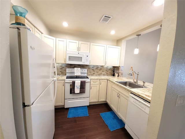1108 Northlake Dr Unit 1108, Sanford, FL 32773 - kitchen with white appliances, a sink, dark wood-style floors, tasteful backsplash, and recessed lighting