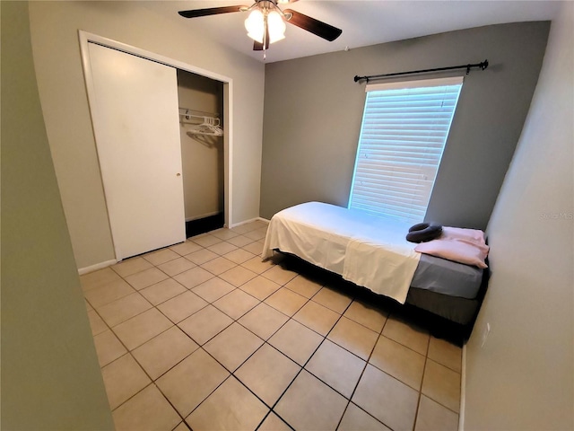 1108 Northlake Dr Unit 1108, Sanford, FL 32773 - bedroom featuring a closet, light tile patterned flooring, ceiling fan, and baseboards