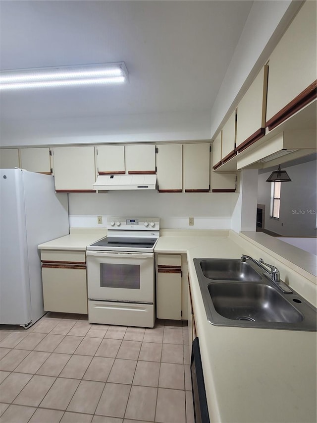 3124 S Semoran Blvd Unit 206, Orlando, FL 32822 - kitchen featuring white appliances, ventilation hood, a sink, and light countertops