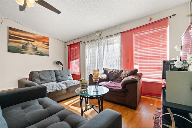 1321 Dunbarton Ct, Kissimmee, FL 34758 - living room with a textured ceiling, a ceiling fan, wood finished floors, and vaulted ceiling