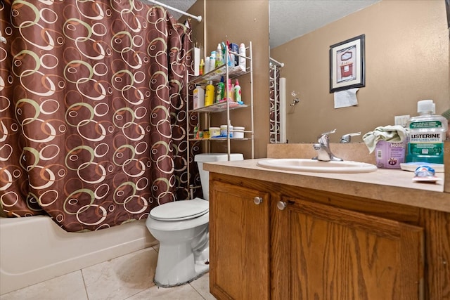 1321 Dunbarton Ct, Kissimmee, FL 34758 - full bathroom featuring toilet, vanity, tile patterned flooring, shower / tub combo, and a textured ceiling