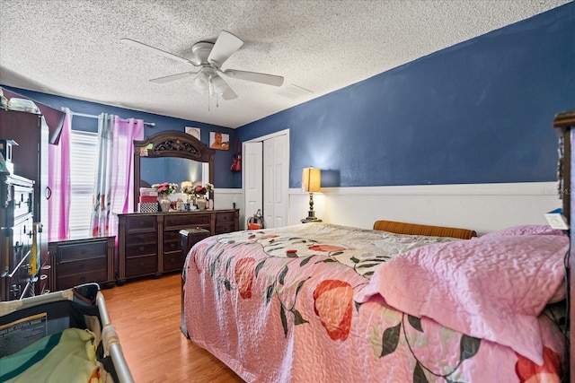 1321 Dunbarton Ct, Kissimmee, FL 34758 - bedroom with a textured ceiling, wood finished floors, a closet, and ceiling fan