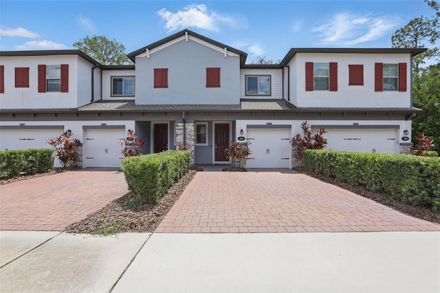 328 Cedar Bark Ln, Sanford, FL 32771 - multi unit property featuring driveway, stucco siding, and a garage
