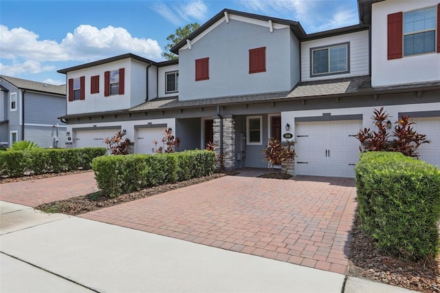 328 Cedar Bark Ln, Sanford, FL 32771 - townhome / multi-family property featuring driveway, an attached garage, and stucco siding