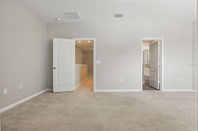 328 Cedar Bark Ln, Sanford, FL 32771 - unfurnished bedroom with light colored carpet, baseboards, and ensuite bath