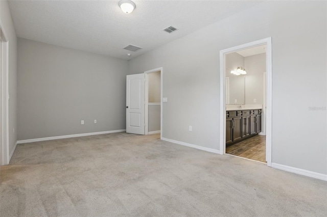 328 Cedar Bark Ln, Sanford, FL 32771 - unfurnished bedroom with carpet flooring, baseboards, and connected bathroom