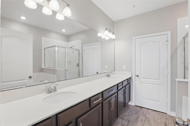 328 Cedar Bark Ln, Sanford, FL 32771 - full bath featuring a stall shower, double vanity, wood finished floors, and baseboards