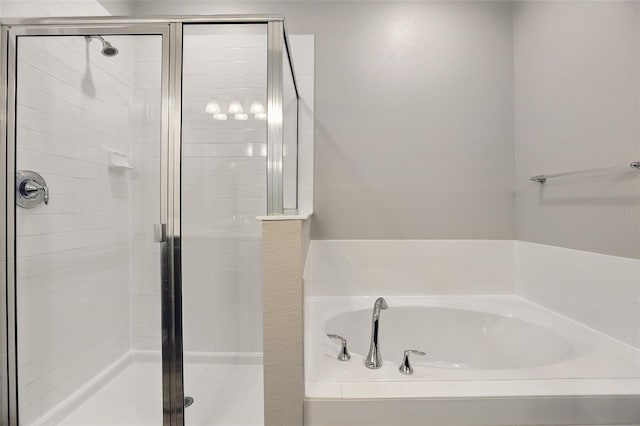 328 Cedar Bark Ln, Sanford, FL 32771 - bathroom featuring a bath and a stall shower