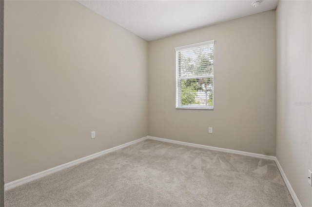 328 Cedar Bark Ln, Sanford, FL 32771 - empty room with light colored carpet, baseboards, and a smoke detector