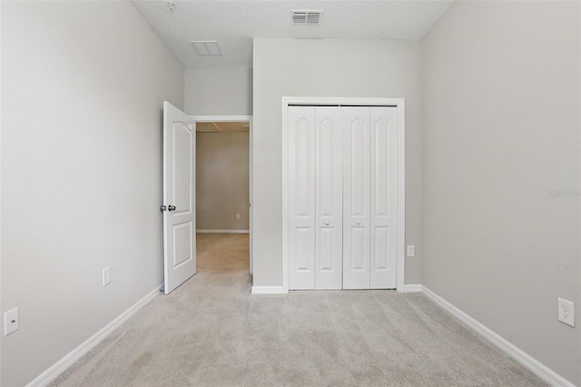 328 Cedar Bark Ln, Sanford, FL 32771 - unfurnished bedroom featuring a closet, light carpet, and baseboards