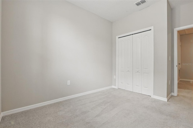 328 Cedar Bark Ln, Sanford, FL 32771 - unfurnished bedroom with carpet flooring, a closet, and baseboards