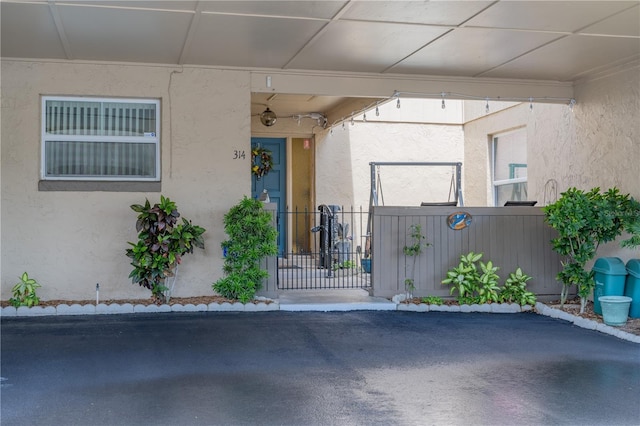 314 Windmeadows St Unit 314, Altamonte Springs, FL 32701 - view of exterior entry with stucco siding and a gate