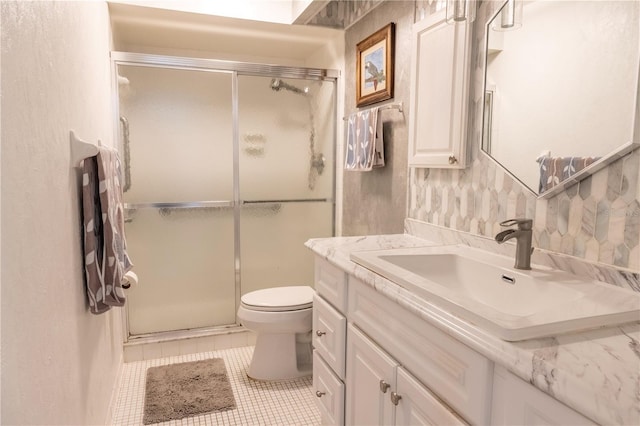 314 Windmeadows St Unit 314, Altamonte Springs, FL 32701 - bathroom featuring vanity, a stall shower, toilet, and tile patterned floors