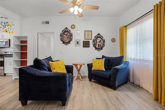 826 Cherokee Cir, Sanford, FL 32773 - living area featuring ceiling fan and light wood-type flooring