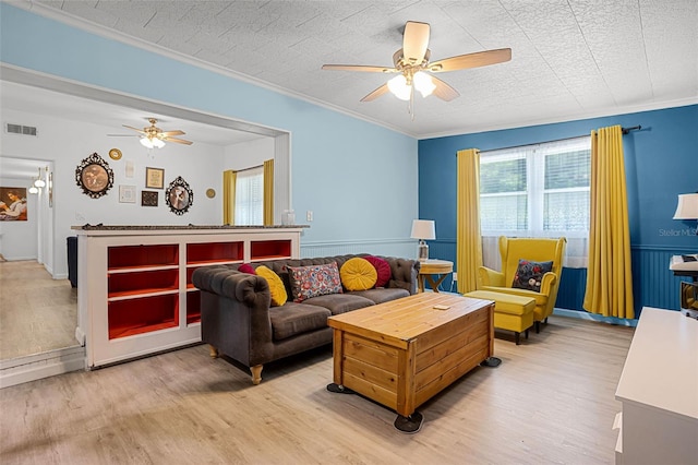 826 Cherokee Cir, Sanford, FL 32773 - living room featuring a ceiling fan, light wood-style flooring, and ornamental molding