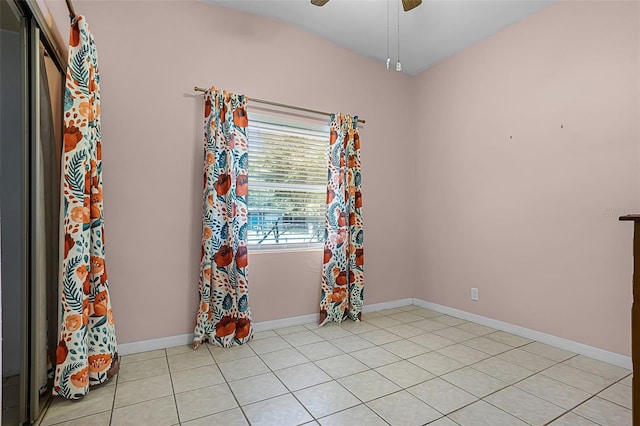 826 Cherokee Cir, Sanford, FL 32773 - empty room with a ceiling fan, light tile patterned floors, and baseboards