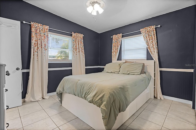 826 Cherokee Cir, Sanford, FL 32773 - tiled bedroom featuring baseboards, lofted ceiling, and a ceiling fan