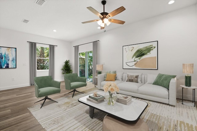 1119 W 7th St, Sanford, FL 32771 - living area featuring wood finished floors, baseboards, recessed lighting, and ceiling fan