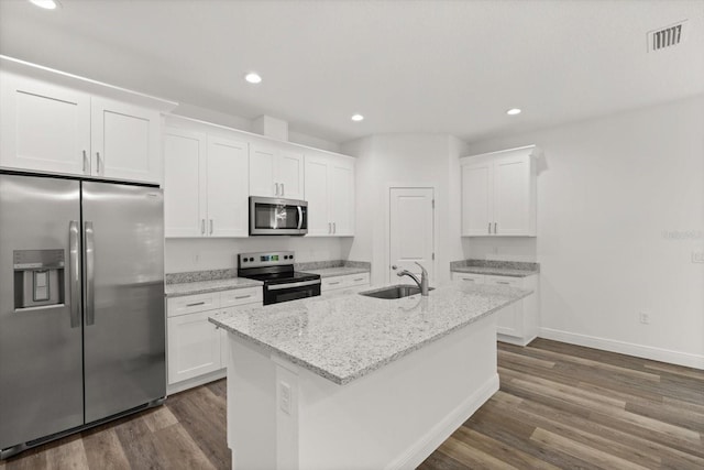 1119 W 7th St, Sanford, FL 32771 - kitchen with appliances with stainless steel finishes, a sink, dark wood-type flooring, white cabinetry, and recessed lighting
