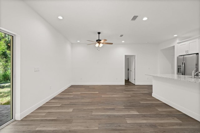 1119 W 7th St, Sanford, FL 32771 - unfurnished living room featuring recessed lighting, ceiling fan, wood finished floors, baseboards, and a sink