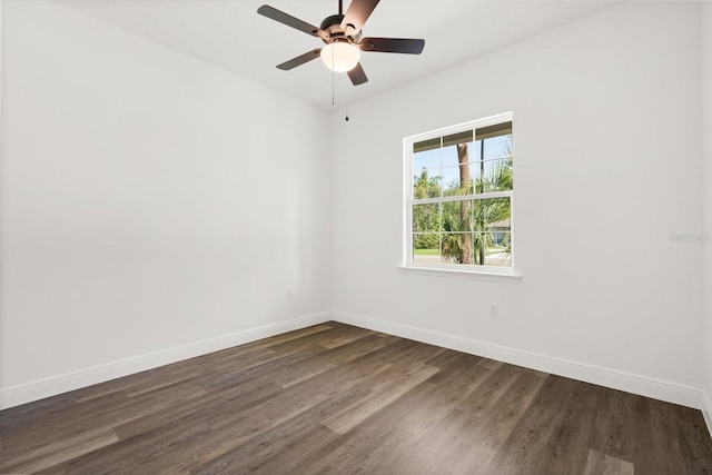 1119 W 7th St, Sanford, FL 32771 - spare room featuring dark wood-type flooring, baseboards, and ceiling fan