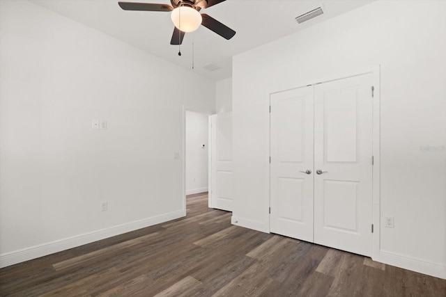 1119 W 7th St, Sanford, FL 32771 - unfurnished bedroom featuring wood finished floors, a closet, and baseboards