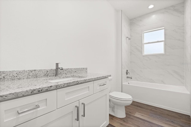 1119 W 7th St, Sanford, FL 32771 - bathroom with vanity, toilet, wood finished floors, shower / bathtub combination, and recessed lighting