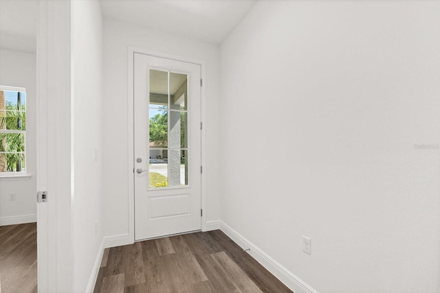 1119 W 7th St, Sanford, FL 32771 - entryway with dark wood-type flooring and baseboards