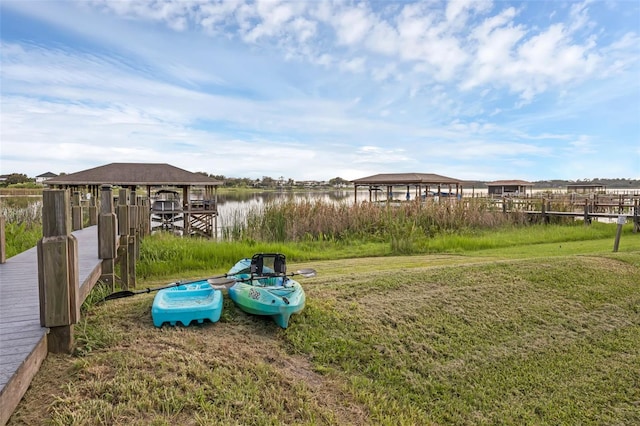 16086 Johns Lake Overlook Dr, Winter Garden, FL 34787 - view of grassy yard with a water view and a dock