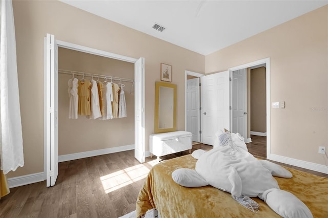 16086 Johns Lake Overlook Dr, Winter Garden, FL 34787 - bedroom featuring wood finished floors and baseboards